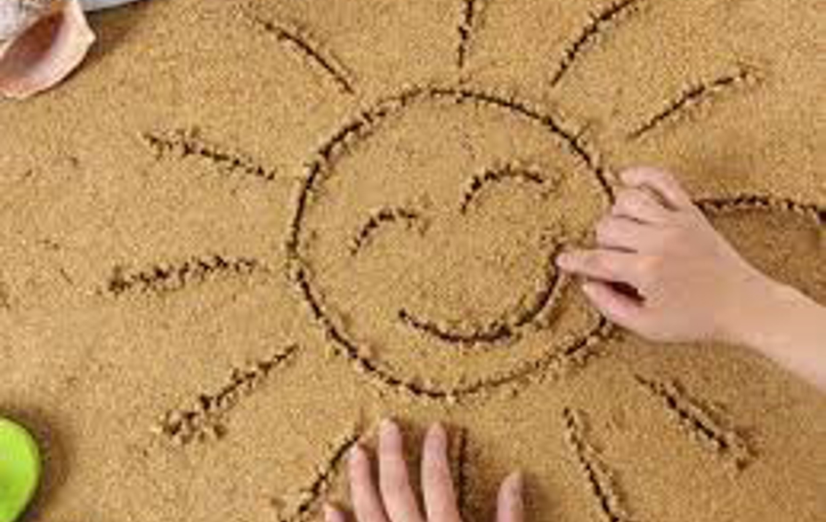 Tegning i sandet af en sol